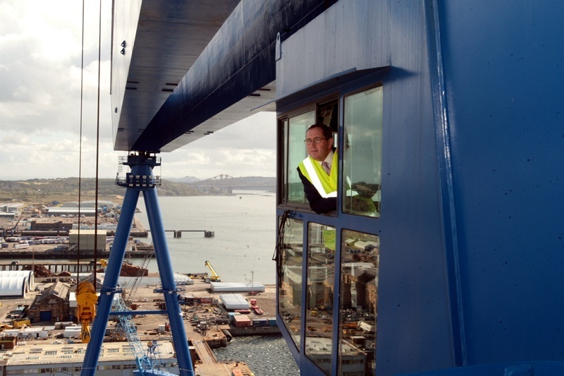 John Stevenson, Courier,20/09/11.Fife.Rosyth,Visit of Minister for Defence Equipment, The Rt Hon Peter Luff MP, to see preparations for the assembly of the new aircraft carrier, and visiting the giant Goliath crane. Pic shows the minister as he looks out over the dockyard from the operators cab of the crane.