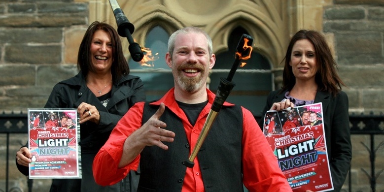 Kris Miller, Courier, 20/09/11. PIcture today at McManus Galleries, Dundee for the launch of the Winter Lights Festival. Pic shows (fire) Juggler, Captian Duncan Smith with Karin Johnston (left, Marketing Assistant) and Jennifer Caswell (right, Team Leader Economic Project).