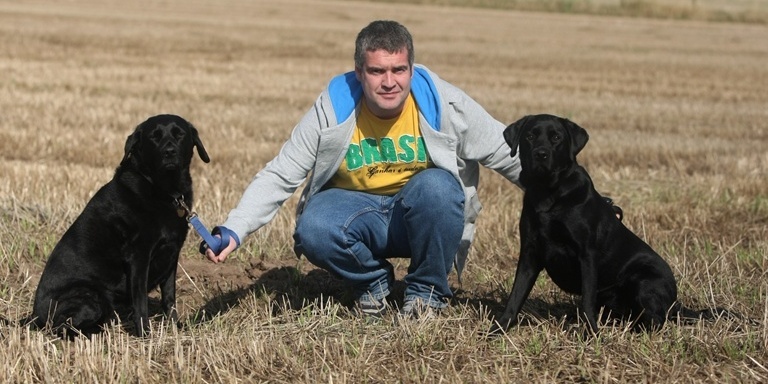 DOUGIE NICOLSON, COURIER, 25/09/11, NEWS. Pictured with his dogs Holly and Cuillan at his home near Letham today, Sunday 25th September 2011, is Cllr Donald Morrison. Story by Graham Brown, Forfar office.