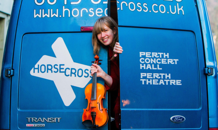 Fiddler Patsy Reid emerges from the Horsecross van for a performance at the Greyfriars Bar in South Street, Perth.