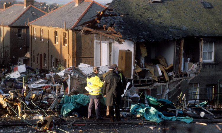 Police officers at the scene in Lockerbie after the Boeing 747  crashed after a mid flight explosion on board in 1988.