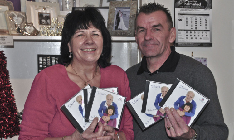 Amanda Kopel and Roy Duncan with copies of the charity CD.