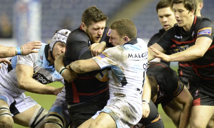 Glasgow Warriors' Duncan Weir (right) fights for the ball with Jack Cuthbert.