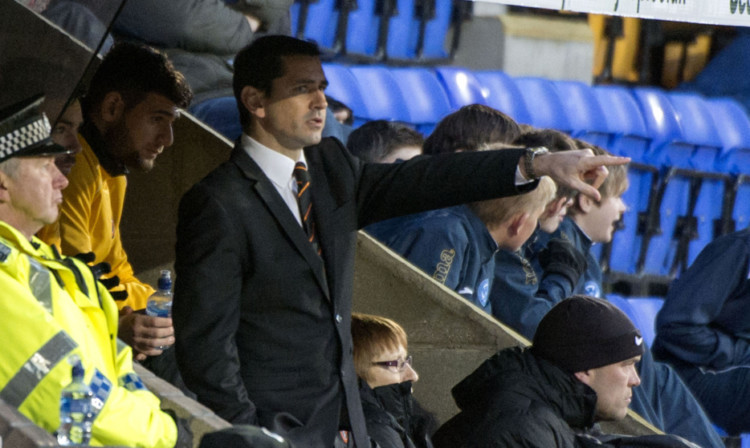 Jackie McNamara watches from the dugout as his much-changed side slump to victory.