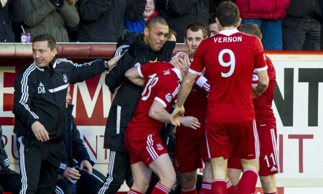 Aberdeen manager Derek McInnes (left) joins in the celebrations after Nicky Low's goal.