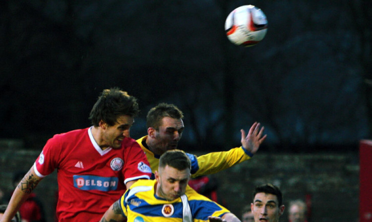 Brechin's Ewan Moyes wins a header.