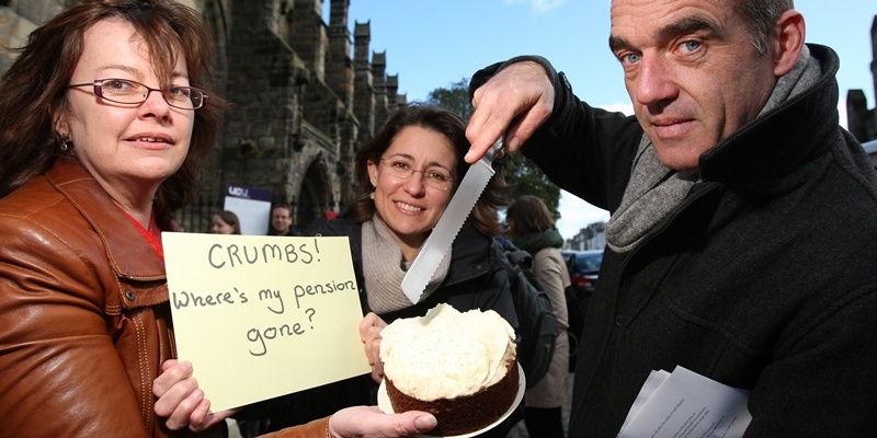 Kris Miller, Courier, 19/10/11. Picture today at Butts Wynd, St Andrews where members of University and College Union were handing out free cake in protest over 'carve up' of their pensions. Pic shows L/R, Dr Leda Blackwood, Dr Paloma Gay-Y-Blasco and Dr Mike Orr 'carving up' some of the free cake.