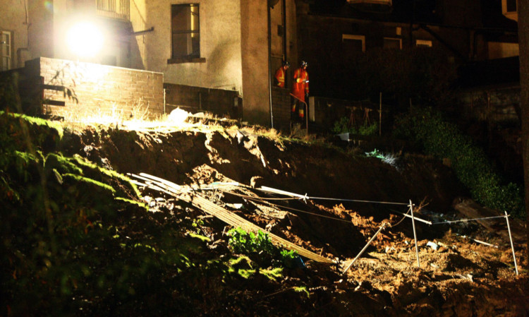 More than 100 people had to be evacuated from more than 40 flats on December 30 after a major landslide caused a wall to collapse in Dundee. Gardens and patios disappeared as tons of earth and rubble tumbled down from the rear of tenements in Gardner Street, crashing into flats below on Lochee Road. This photo shows part of the hole left behind after the landslide.
