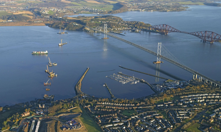 An aerial view of the construction work on the Queensferry Crossing shows the line of caissons marking the position of the support piers and towers upon which the new bridge will be built.