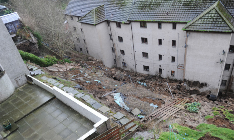 The landslip sent debris crashing down from gardens behind flats on Gardner Street and into the rear of flats on Lochee Road.