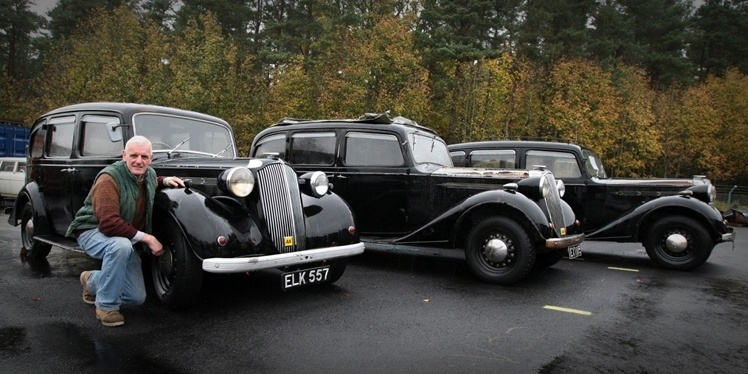 DOUGIE NICOLSON, COURIER, 25/10/11, NEWS. Pictured at the Strathmore Vintage Vehicle Club's HQ near Glamis today, Tuesday 25th October 2011, is Chairman of the SVVC Alan Burt with the three Vauxhall 25 Limousine Taxis from 1937. Story by Forfar office.