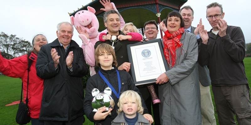 Kris Miller, Courier, 25/10/11. Picture today at Madalen Green shows Dominic and Lola Venditotzz being presented with the Guinness World Record for the largest piggyback race. The pair won the race which was held in the summer.