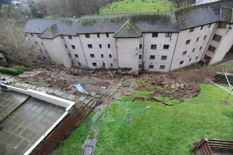Contractors have been working to stabilise the ground after a landslide in Dundee on December 30. Over 100 people were evacuated after gardens behind three tenements in Lochees Gardner Street disappeared down a steep hill on Monday afternoon, crashing into the flats on Lochee Road below.