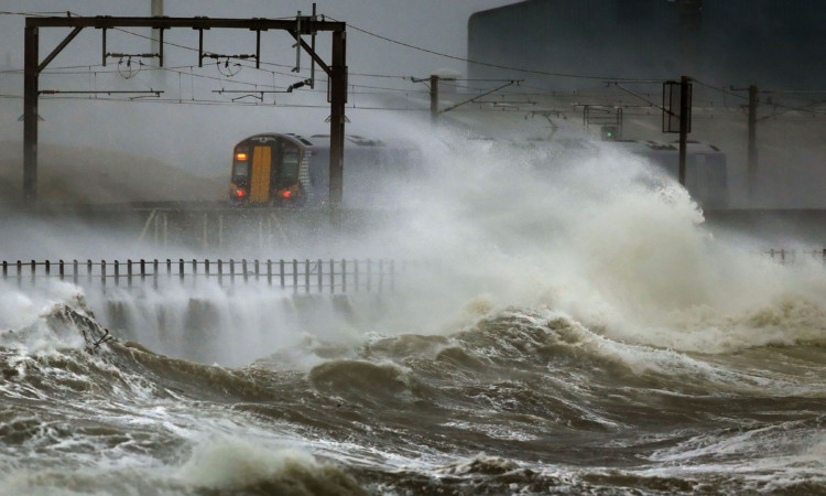 A train is battered by wind and rain at Saltcoats.