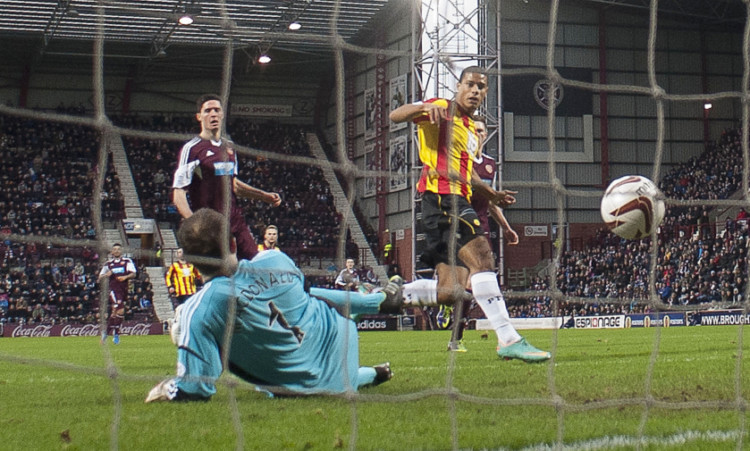 Partick Thistle striker Lyle Taylor (right) opens the scoring at Tynecastle.