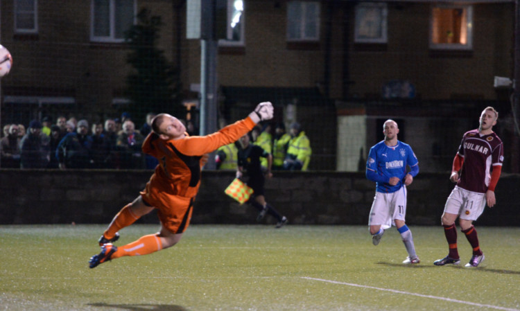 Nicky Law scores his second goal of the match in stoppage time.