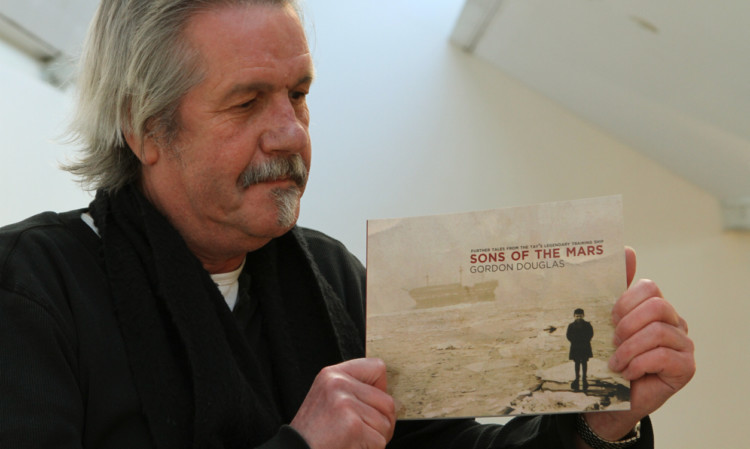 Gordon Douglas with a copy of his new book, Sons of the Mars.