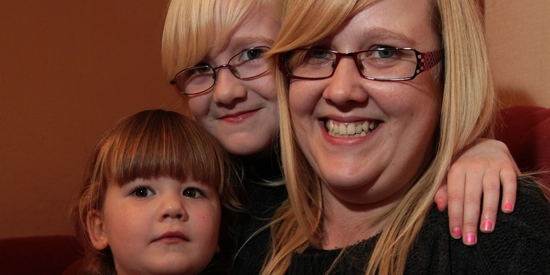 Kim Cessford, Courier - 04.11.11 pictured at home - 32 Kinghorne Place with the hip flask returned thanks to The Courier - words from Alan Wilson - l to r - Zoe and Faith Higgins with mum Ann Ingram