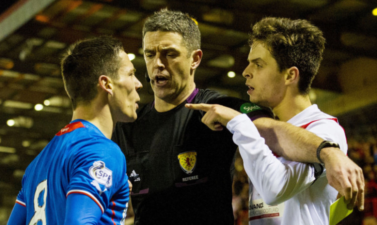 Referee Greg Aitken is forced to get between warring pair Ian Black (left) and Airdrieonians' Jamie Bain.