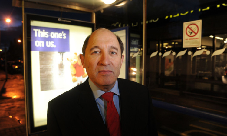 Councillor Laurie Bidwell at the illuminated bus shelter outside Marks and Spencer in Broughty Ferry.