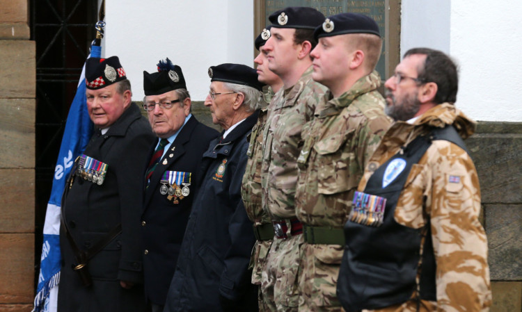 Royal Engineer veterans and members of the TA form a guard of honour at the funeral of Robert McVey.
