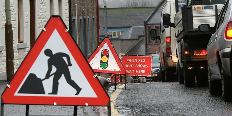 Kris Miller, 14/11/11. Picture today at West Port junction, Forfar shows traffic with numerous signs for story about chaotic roadworks.