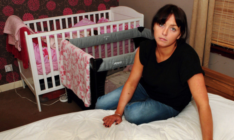 Louise Brown in the bedroom she shares with her partner and their two toddler daughters.