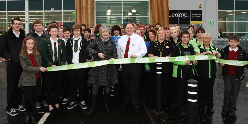 Kris Miller, 14/11/11. Picture today at opening of the new Asda store, West Way, Arbroath. Pic shows Ann Craig and store manager Robert Wallace performing the opening with staff from the store and pupils from Arbroath High.
