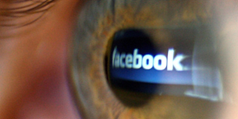 Embargoed to 0001 Wednesday October 19
Undated file photo of the logo of social networking website Facebook seen reflected in a person's eye. Facebook may be changing people's brains as well as their social world, research has shown.