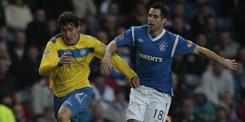 Ranger's Carlos Bocanegra (right) and St Johnstone's Francisco Sandaza battle for the ball during the Clydesdale Bank Scottish Premier League match at Ibrox, Glasgow.