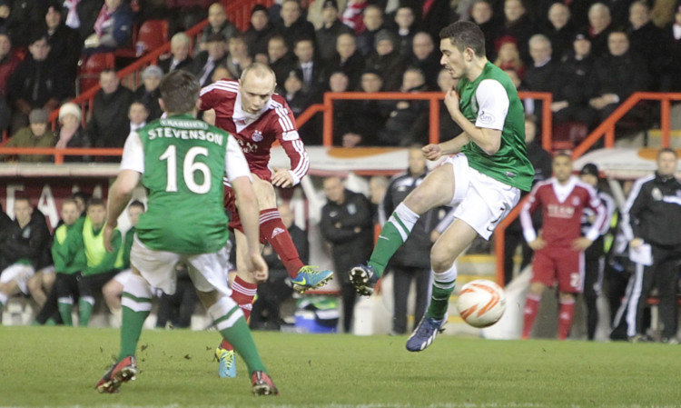 Willo Flood fires in Aberdeens winning goal with just four minutes left.