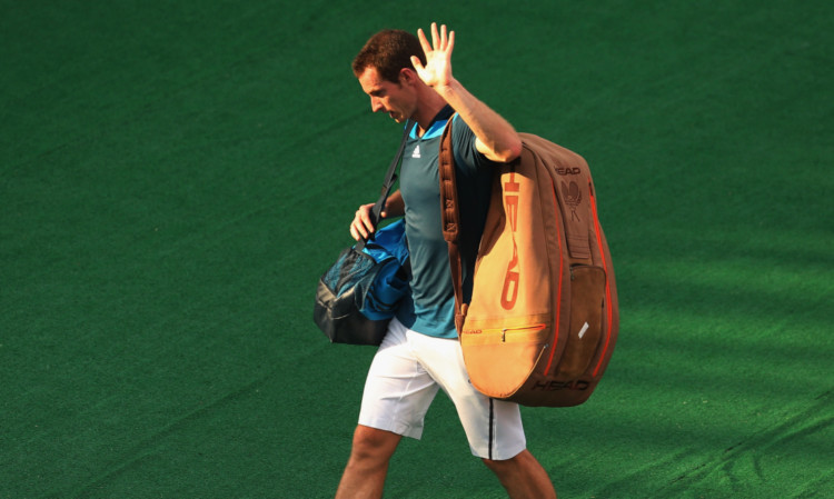 Andy Murray leaves the court after losing following his match against Lleyton Hewitt of Australia.