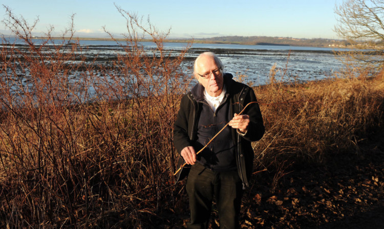Dr John Emery-Barker with the Japanese Knotweed.