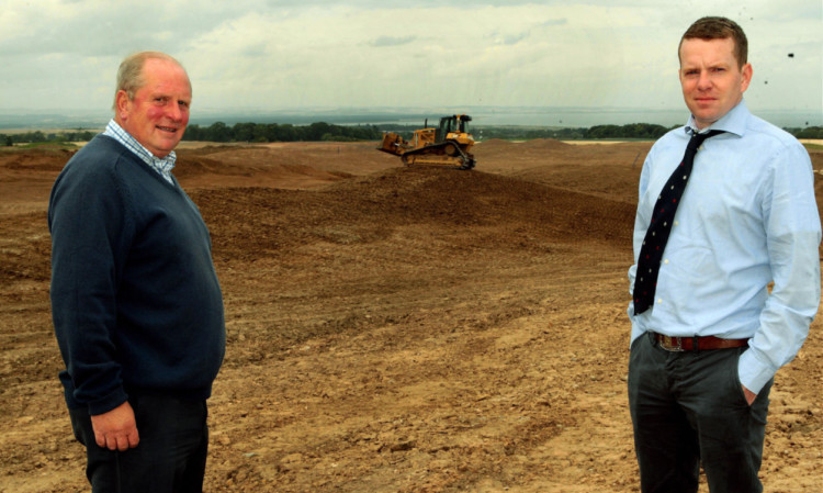 Ewan McKay and his son Bruce at the Feddinch site and below the Old Course.