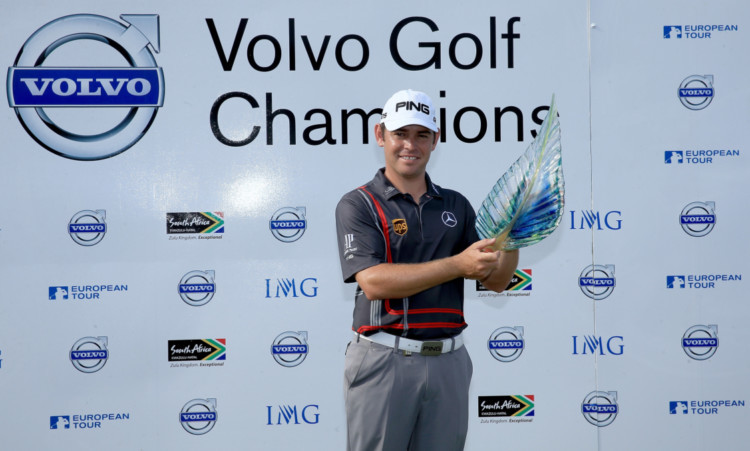 Louis Oosthuizen holds the trophy after his victory.