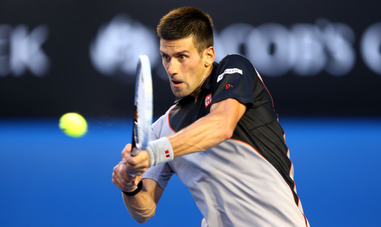 Novak Djokovic plays a backhand in his first round win against Lukas Lacko.