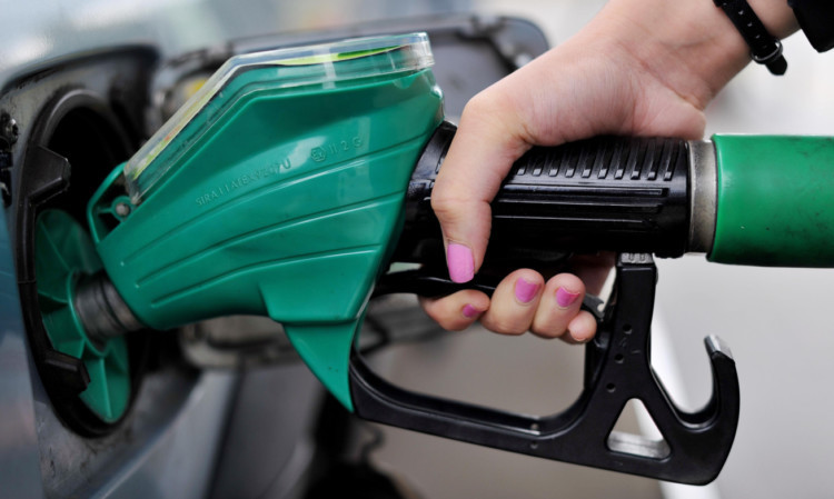 A view of a person using an Asda petrol pump in Chelmsford, Essex. PRESS ASSOCIATION Photo. Picture date: Thursday August 15, 2013. Photo credit should read: Nick Ansell/PA Wire