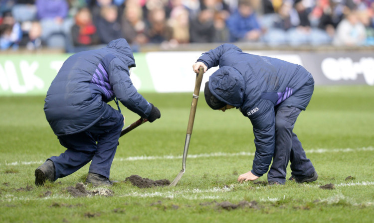 Groundsmen get to work on the Murrayfield pitch before Scotlands autumn Test against Japan.