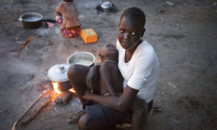 A displaced woman and baby who fled the fighting and made it across the White Nile earlier this month.