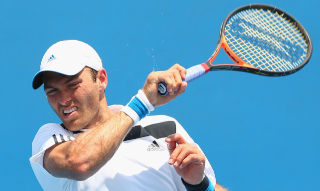 Ross Hutchins plays a forehand in his first round doubles match with Colin Fleming against Marinko Matosevic and Michal Przysiezny.
