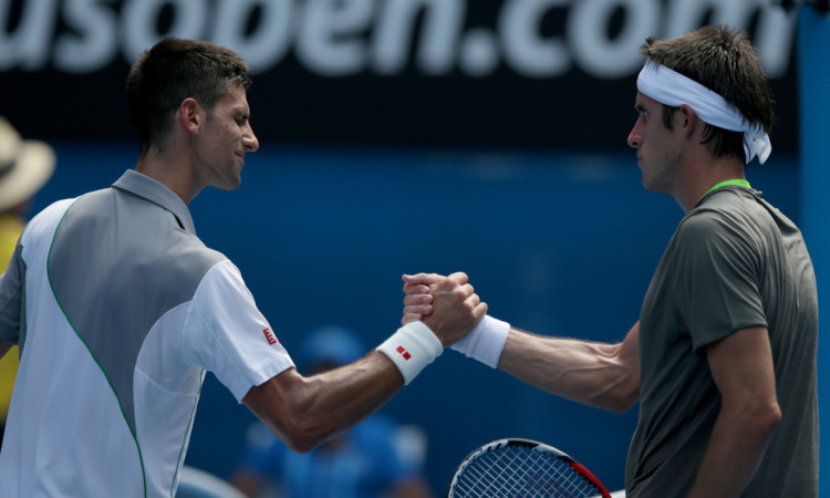Novak Djokovic, left, is congratulated by Leonardo Mayer after winning their second round match at the Australian Open.