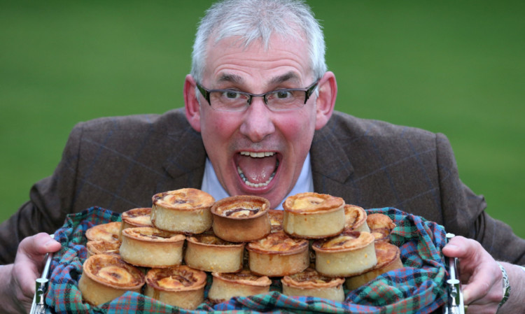 Stephen McAllister, from Kandy Bar bakers in Saltcoats, celebrates after being presented with his prize at The Scotch Pie Awards.