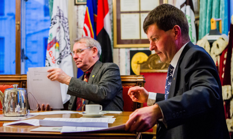 From left, Councillor Ken Guild and Councillor Willie Sawers with the budget at the city chambers.