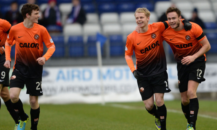 Andy Robertson, left, manages a wry smile as Gary Mackay-Steven congratulates Keith Watson after the full-back added another goal to his tally at Inverness.