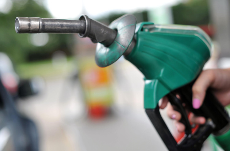 A view of a person using an Asda petrol pump in Chelmsford, Essex. PRESS ASSOCIATION Photo. Picture date: Thursday August 15, 2013. Photo credit should read: Nick Ansell/PA Wire