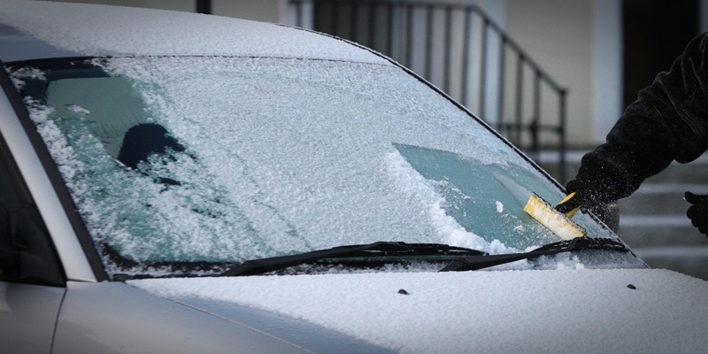 Steve MacDougall, Courier, Rose Terrace, Perth. Weather picture to illustrate the snowfall and frost overnight in Perth. Pictured, a resident clears her car windows of frost. No name.