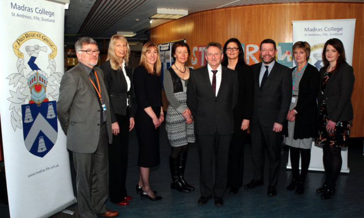 College rector David McLure, centre, with, from left, Ken Keighran, Lindsey Stanley, Linda Brown, Stephanie Gibson, Madeline McCutcheon, David Barnett, Kathleen Blacklaw and Hazel Sly.