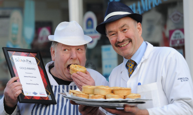 Dave OBrien, left, and Alan Pirie show off the award-winning pies.