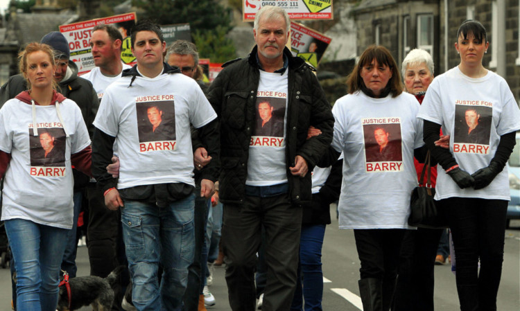 Barry McLeans partner Jennifer, his brother Craig, father Alan, mother Tina and sister Lisa marching against knife crime last year.