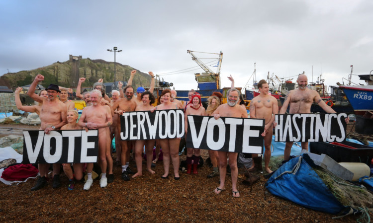Residents in Hastings, bare all in a naked flash mob on the beach, as the Jerwood Gallery in the town competes to win a photographic portrait session with photographer Spencer Tunick.